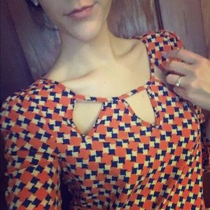 Blue and burnt orange blouse.
